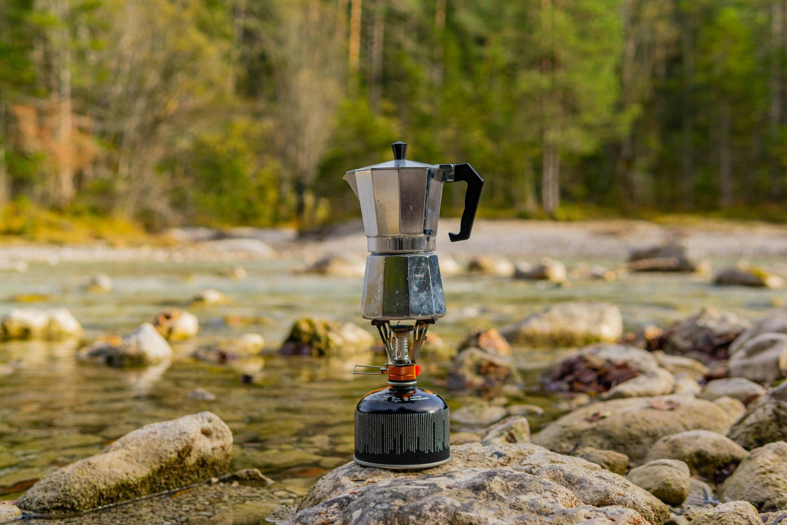 Moka Pot Coffee Brew, Image showing Coffee is being brewed in Moka Pot outdoor Five Roam Coffee Brew help, how to brew with moka pot, specialty coffee, fiveroamcoffee