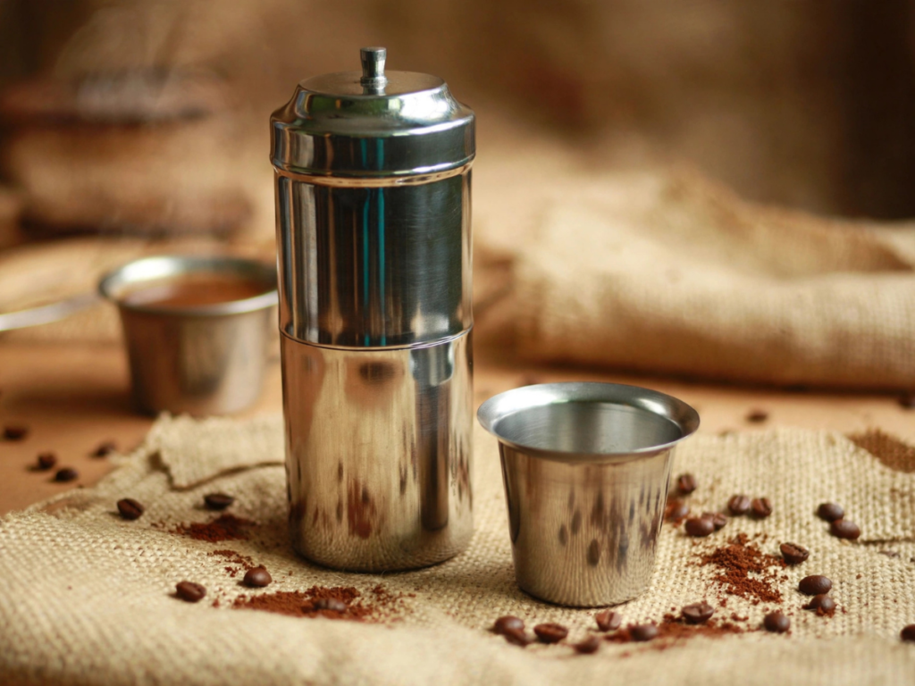 South Indian Coffee Filter and Coffee Tumbler is kept on the table