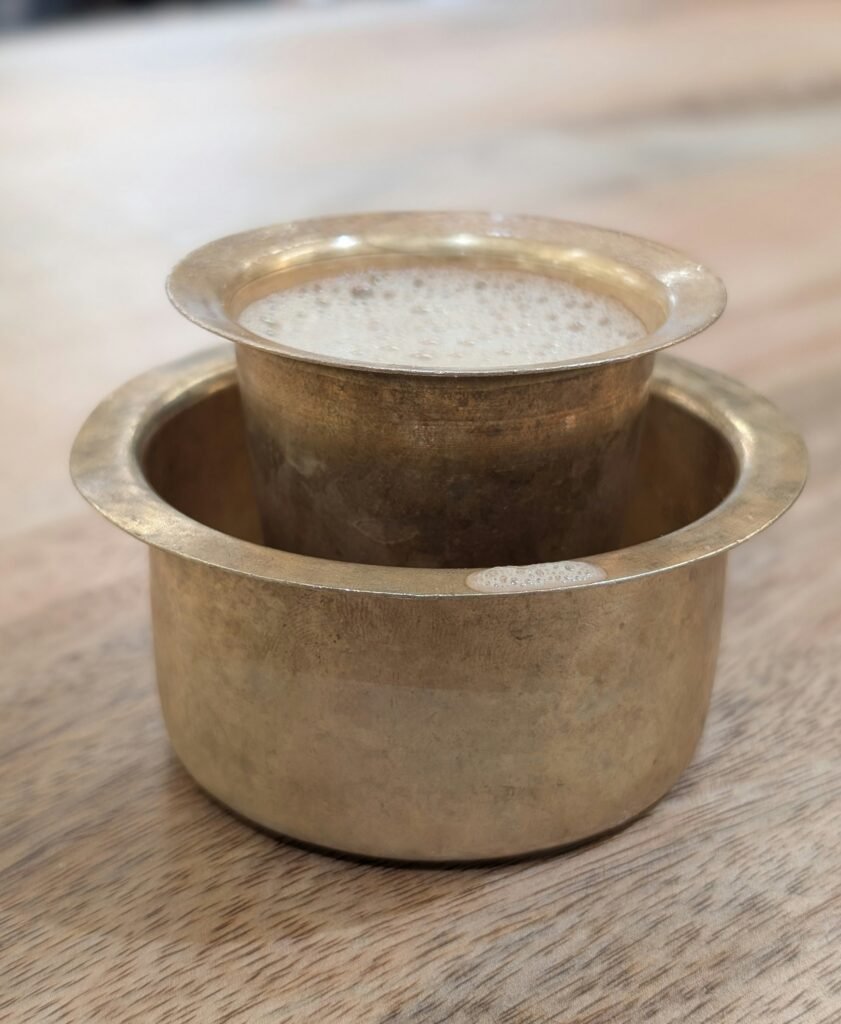 A Coffee brew from South Indian Coffee Filter in kept in the glass